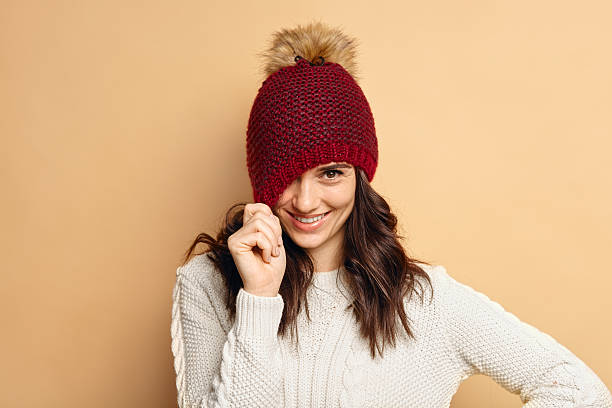 istock young woman wearing knitted pullover over beige background 628091720