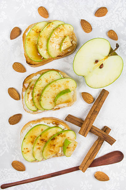 Three sweet toasts with cheese, apples and honey
