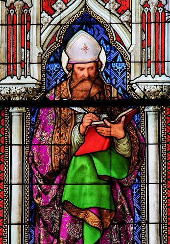 Cologne, Germany - April 21, 2010: Stained Glass in the Dom of Cologne, Germany, depicting Saint Augustine, one of the four Latin Church Fathers.