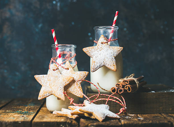 bottles with milk, christmas festive cookies, decoration rope, spices - milk milk bottle drinking straw cookie imagens e fotografias de stock