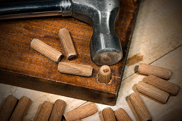 istock Wooden Dowels on a Brown Plank 628093972