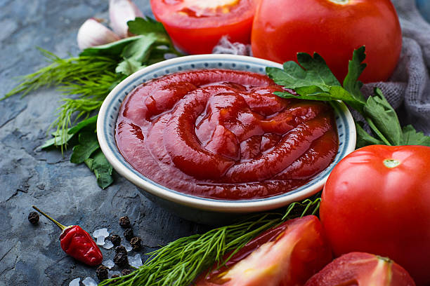 istock Tomato ketchup sauce on concrete background 628094066