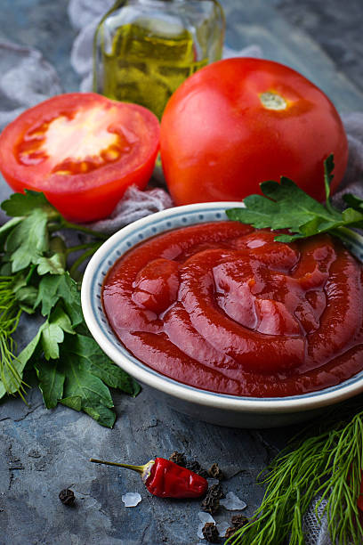 istock Tomato ketchup sauce on concrete background 628094152