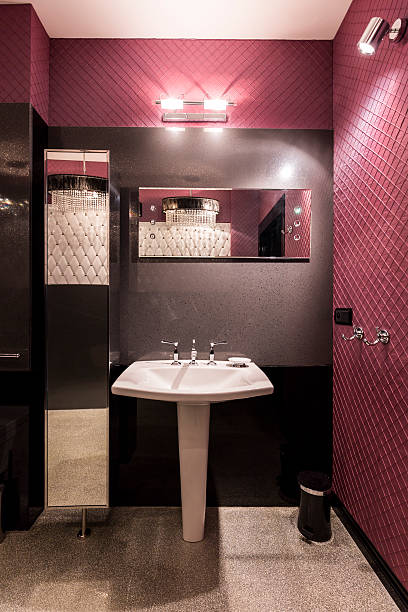 istock White sink in dark bathroom 628094282