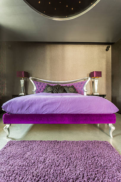 istock Bed in extravagant silver bedroom 628094310