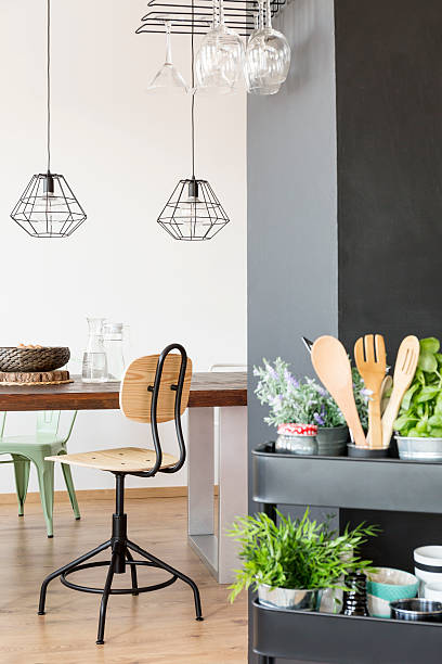 istock Communal table and industrial lamps 628094992