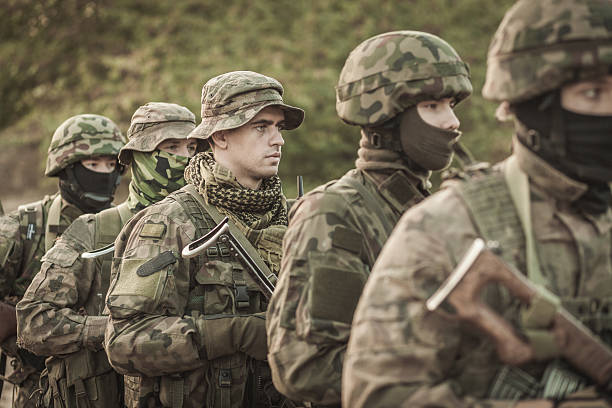istock Male soldiers in battle uniforms 628095976