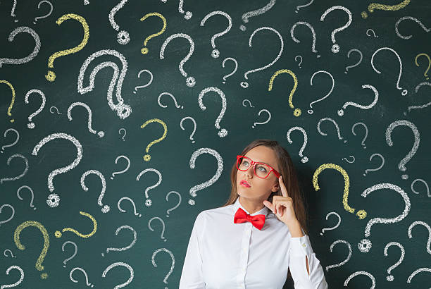 istock Young woman thinking with blackboard 628096622