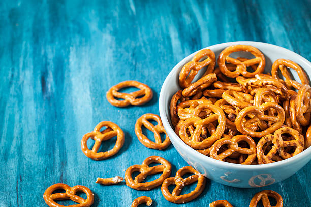 istock Salty snacks mini pretzels in bowl 628096718