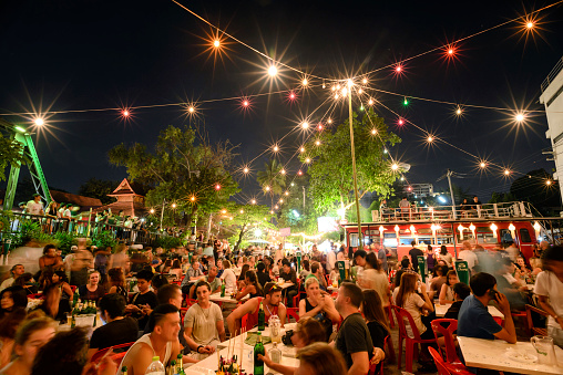 Chiang Mai, Thailand - November 14, 2016 : Super fullmoon Loi-Krathong festival, Unidentified tourists have come to reserve area restaurant to watch the full moon on the Ping river. which today can match the Loi-Krathong festival of making a jolly tour.