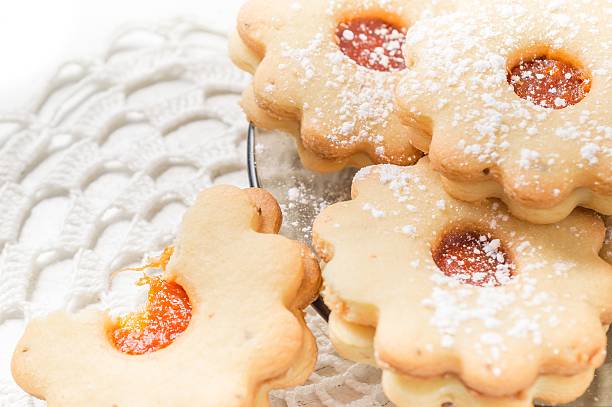 istock Homemade apricot jam Linzer bite with icing sugar on the 628098202