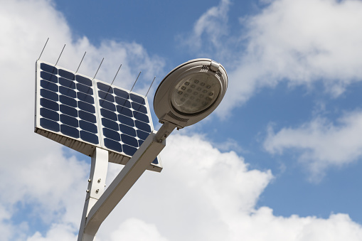 LED street light with solar cell and blue sky background on the street
