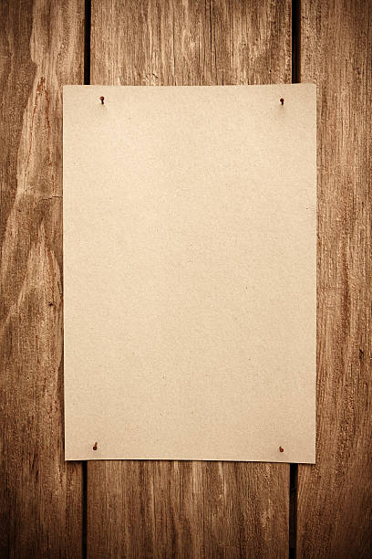 istock Blank Brown paper notice on wood background textured 628099376