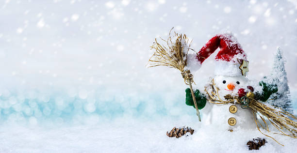 istock Happy snowman standing in winter with copyspace 628101290