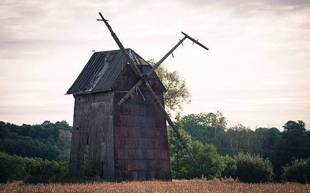 istock Kawnice, Poland. Old ruined windmill on the field. 628101474