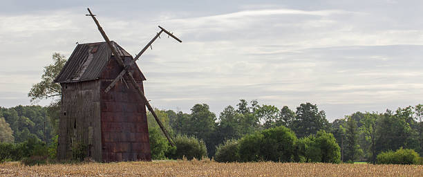 istock Kawnice, Poland. Old ruined windmill on the field. 628101584