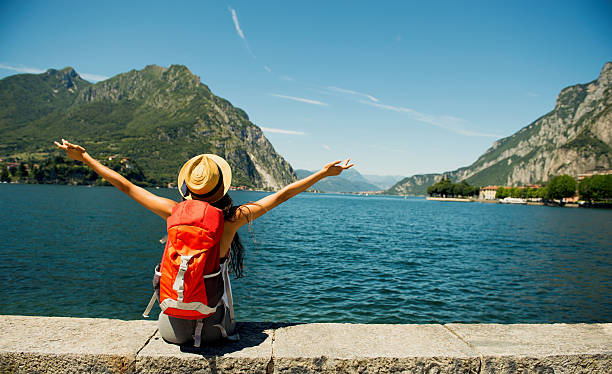 Female traveler. Female traveler enjoying view to lake como italy stock pictures, royalty-free photos & images