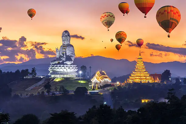 Photo of Colorful hot air balloons flying over Wat Huay Pla Kang