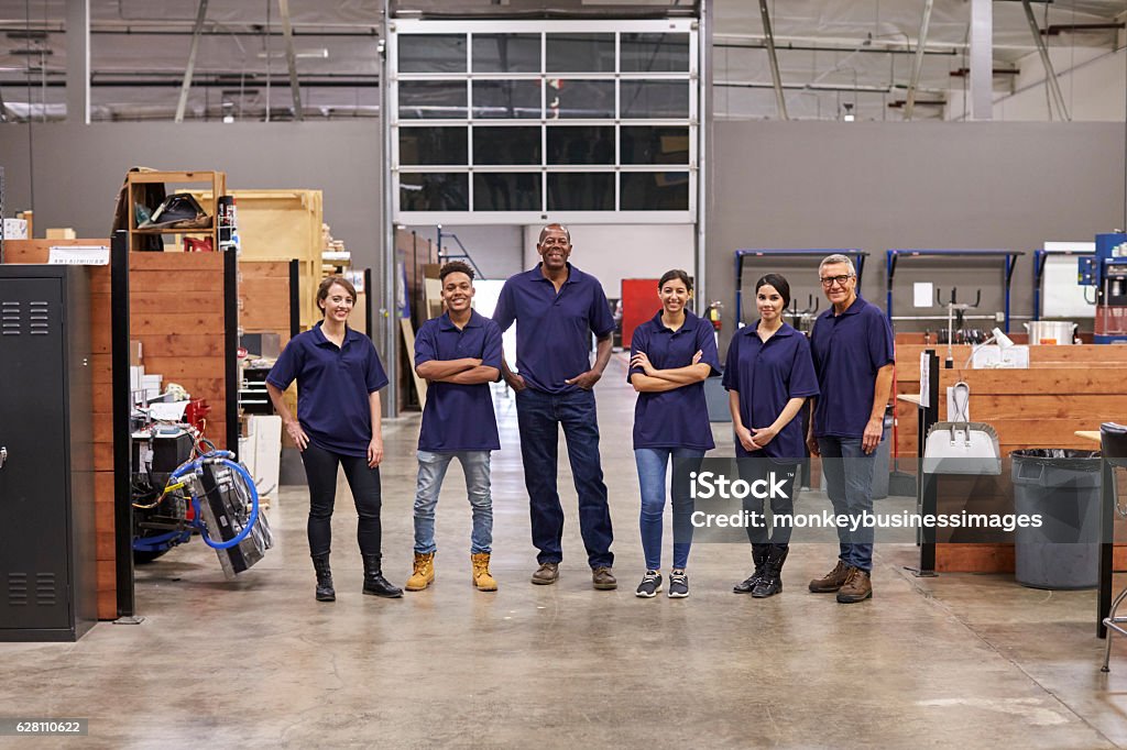 Portrait Of Engineers And Apprentices In Busy Factory Craftsperson Stock Photo