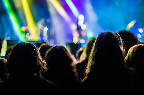 istock concert ray light live people music audience bokeh band head 628111456