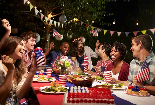 Friends Celebrating 4th Of July Holiday With Backyard Party