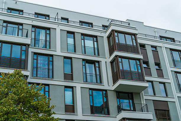 istock very modern building with big windows and balcony 628112342