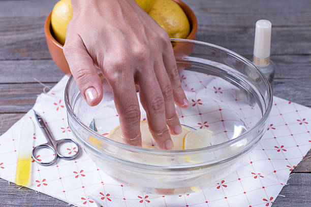 istock woman hand on spa treatment with lemon 628117178