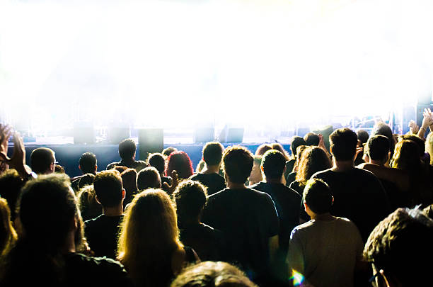 istock concert ray light live people music audience band head bright 628117538