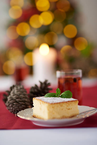 istock Cheesecake and Christmas tree in the background 628118514