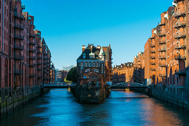 istock Two bridges across river with apartment in middle 628118576