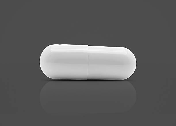 istock white medicine capsule isolated on gray background 628120306