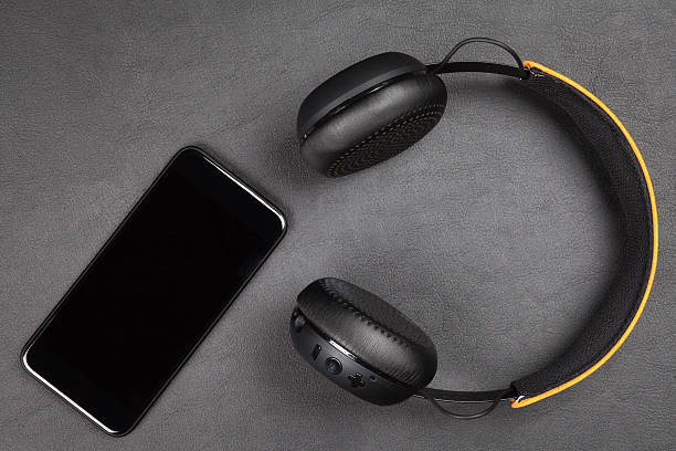istock Black modern smartphone and headphones 628121214