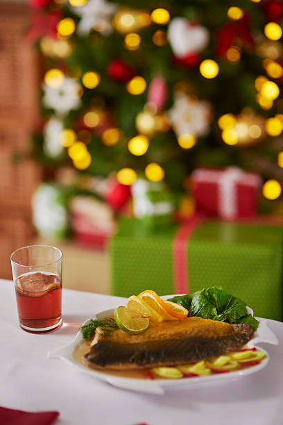 istock Traditional fish and Christmas tree in the background 628121344