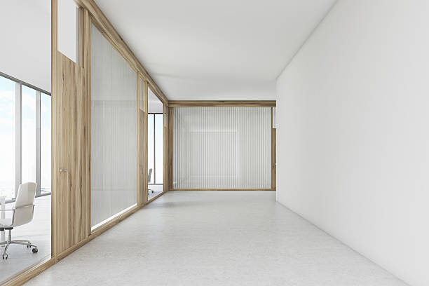 istock Empty office corridor with a wooden door meeting room 628121558