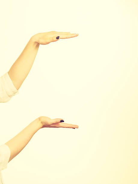 istock Woman hands indicating area of frame, copy space for product 628122112