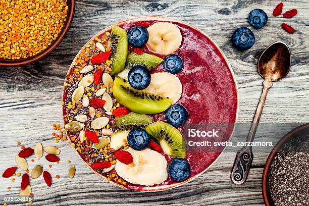 Acai Breakfast Superfoods Smoothies Bowl With Chia Seeds Bee Pollen Stock Photo - Download Image Now