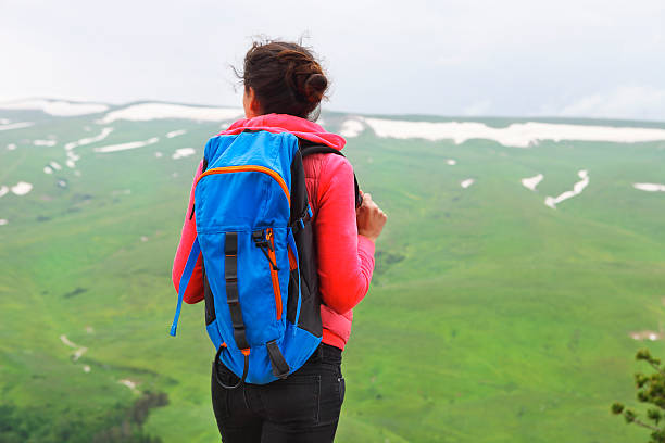 istock Hiker with backpack relaxing on top of mountain 628125868