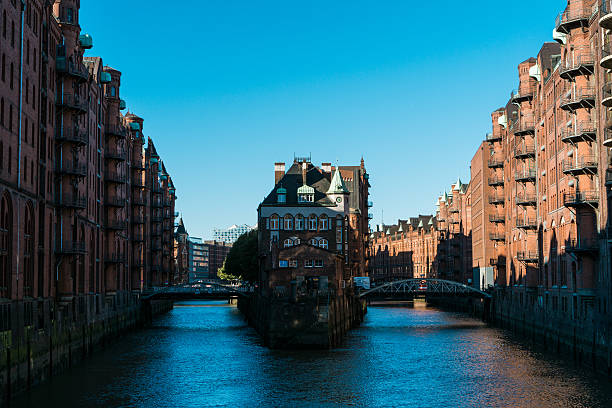 istock Apartment building in between lofts along river 628125936