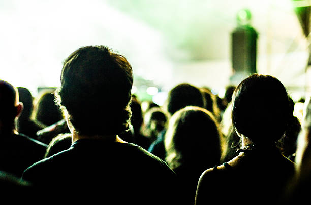 istock concert ray light live people music audience bokeh band head 628133790