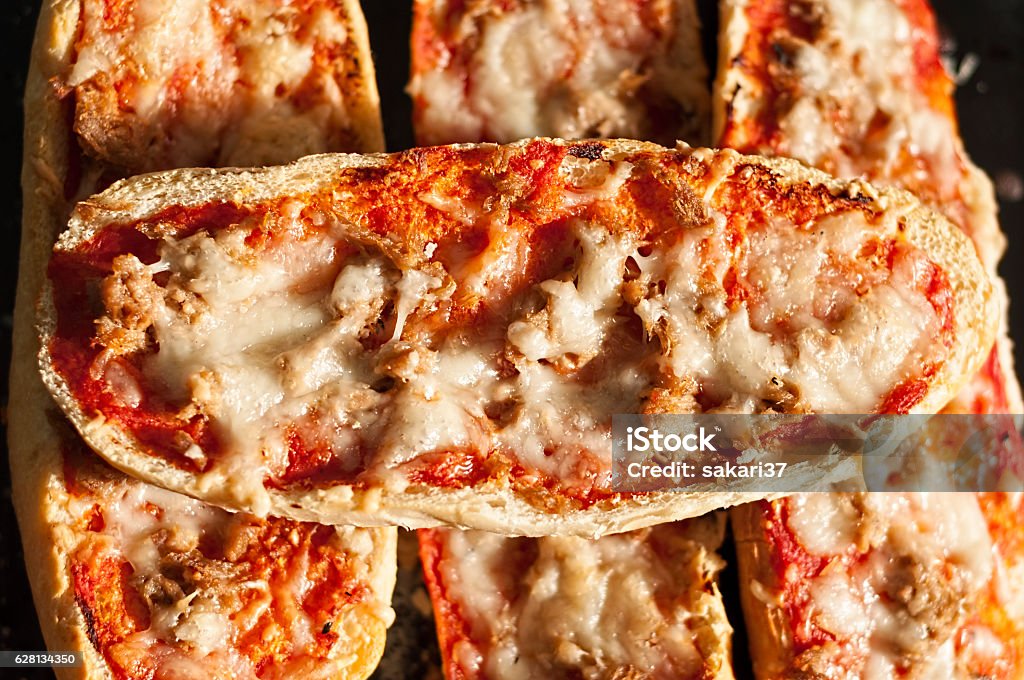 Pizza Baguettes Fresh made Pizza Baguettes on a plate with tuna Pizza Stock Photo