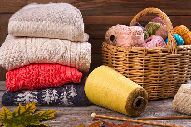 istock Hand made clothes on wooden wall background. 628134532