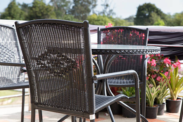 istock brown wicker chair and table on terrace 628136496