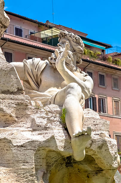 istock Statue cropped in Bernini's Fountain, Piazza Navona, Rome Italy 628136558