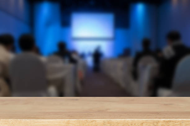istock people sit on rows of chairs in large conference convention 628136882