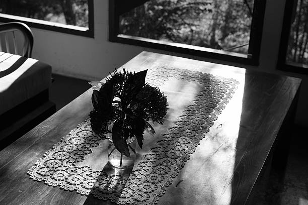 istock ixora flower in vase on wood table near window, black 628136892