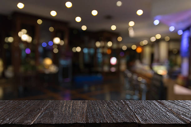istock blur background of pub restaurant with wood table 628137314