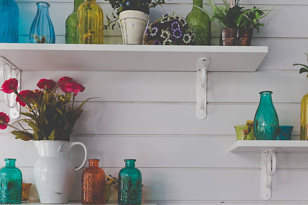 istock vintage retro glass bottle decorating on shelf on white wall 628137840