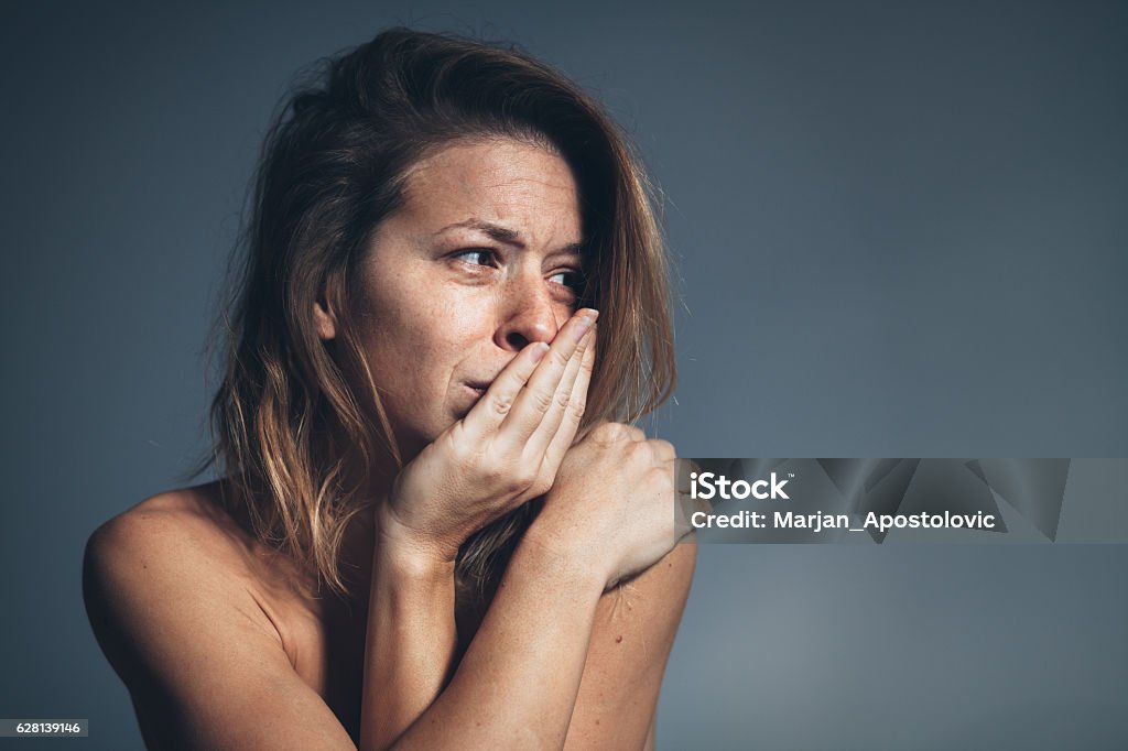 Young woman sad and depressed Young woman sad and depressed, studio shot Women Stock Photo