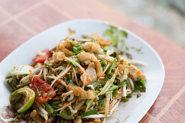 istock spicy papaya salad with fried pork skin 628139802