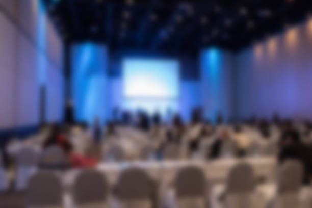 istock people sit on rows of chairs in large conference convention 628140186